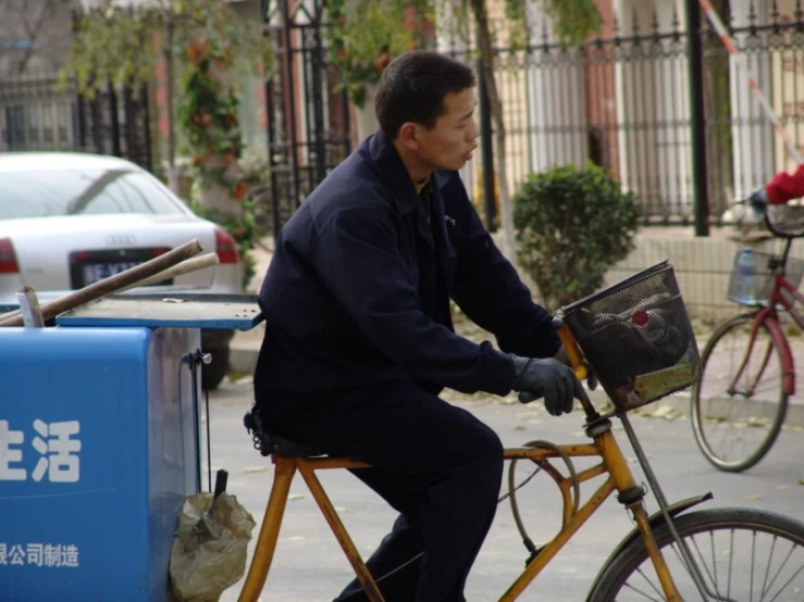 a man is riding his bike with a laptop on it