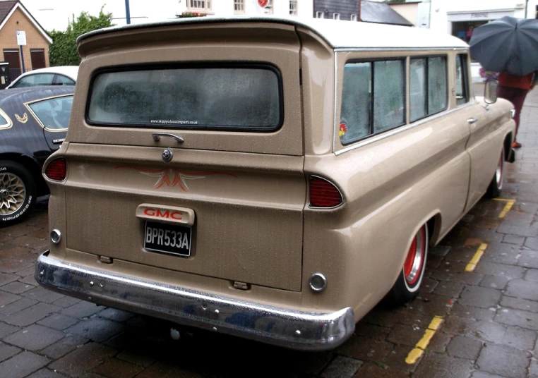 old station wagon car parked in the street