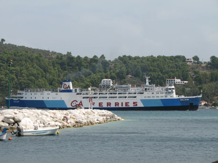 a large ferry boat is entering a port