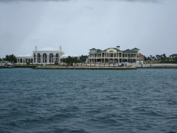 a house on the beach by the water