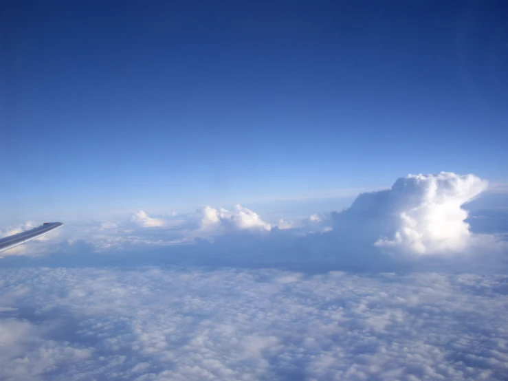 a view of clouds from an airplane in the air