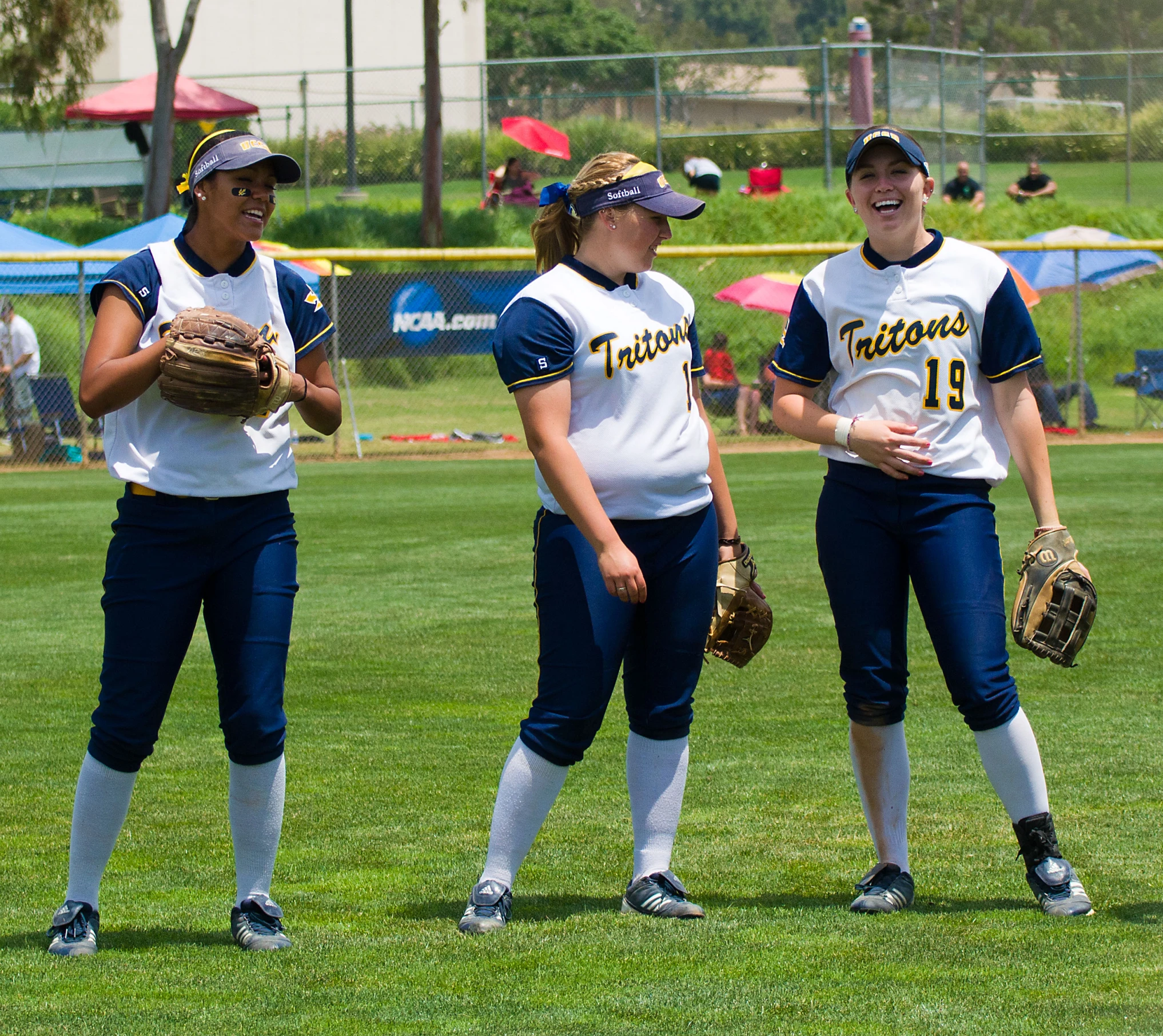 some female softball players talking about the game