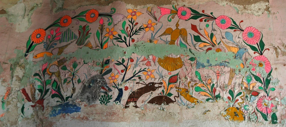 an ornate painted wall with animals and flowers