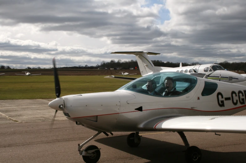 a small plane is on the ground at an airport