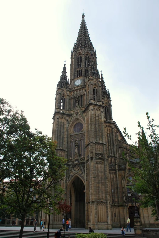 a very tall church building with a clock on the top of it