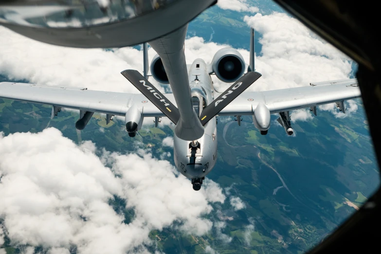 an aerial view of the underside of a silver plane