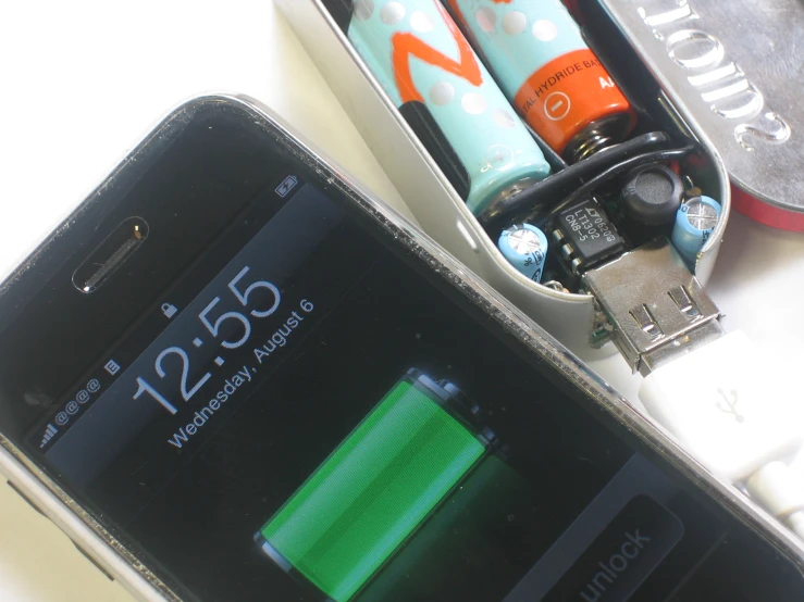 a smart phone that is plugged in a battery holder