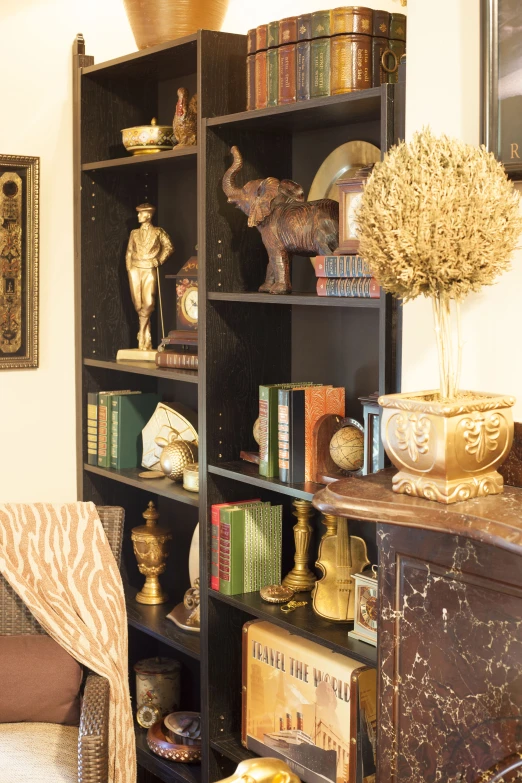 a bookcase with lots of books on it and a vase in the middle