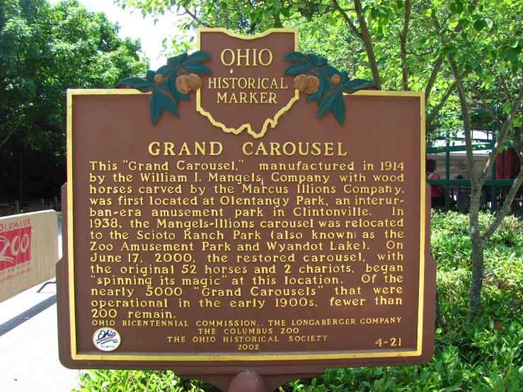 a sign showing information to the grand carousel