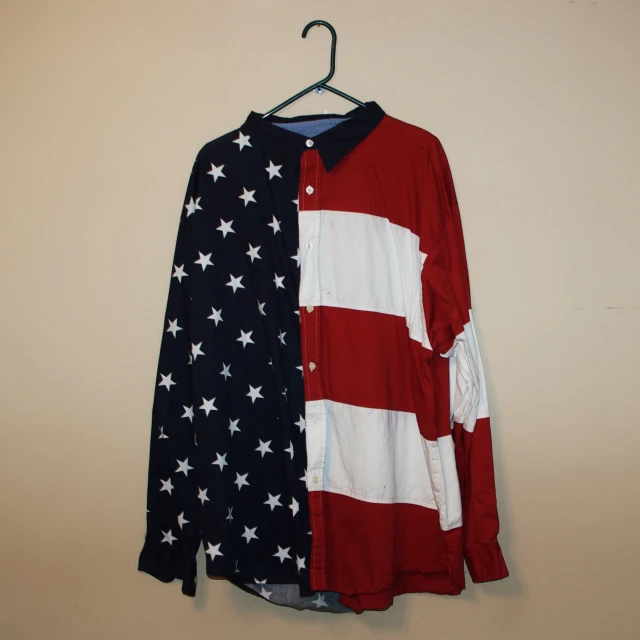 a shirt on the clothes hanger is a long sleeved american flag shirt