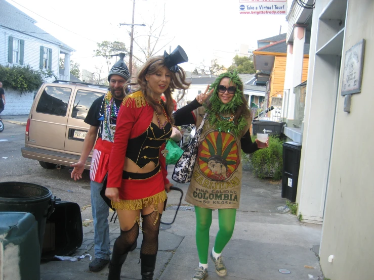 three friends are all dressed in costumes for halloween