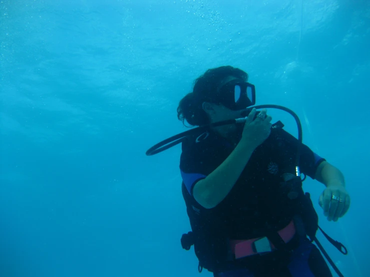 a woman with scuba gear is in the water