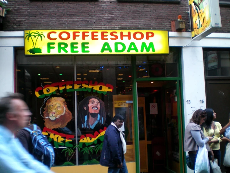 a man standing in front of a coffee shop