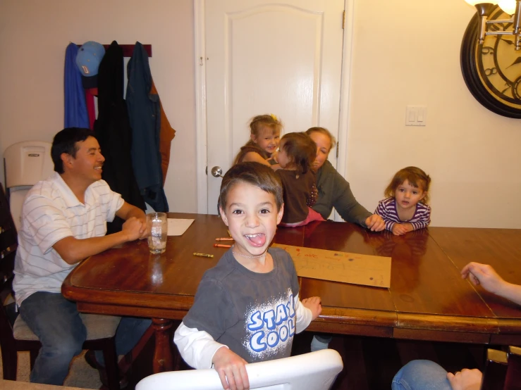 a group of people sitting around a table