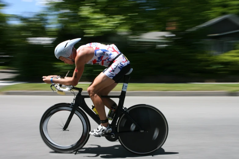 a person riding a bicycle down a road