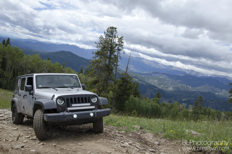 jeep in the middle of a dirt trail