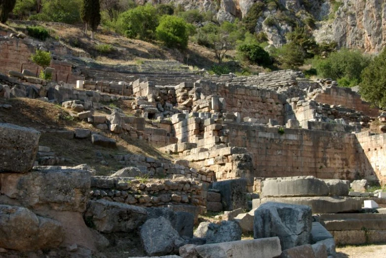 a group of stone steps sit on top of a hill