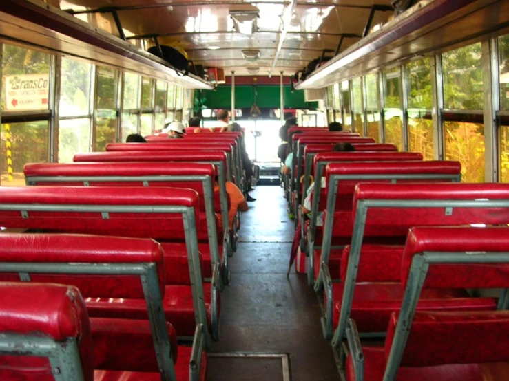 the interior of a train car full of seats