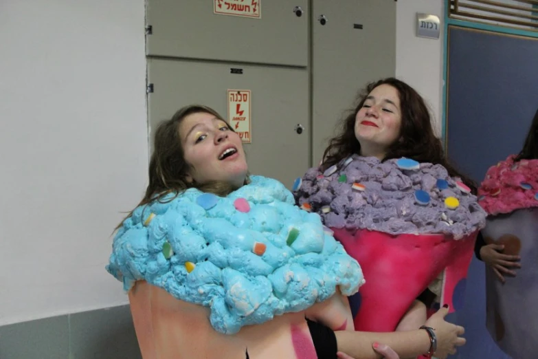 two young ladies are laughing with their hair dyed