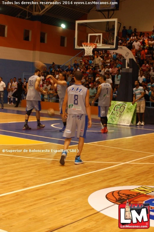 basketball game showing court with blue and yellow