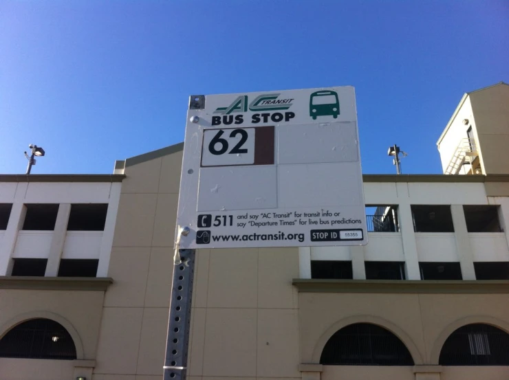 a bus stop sign showing the bus stop and other direction