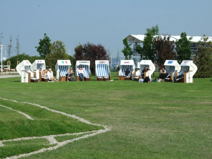 group of chairs set up in field for art show