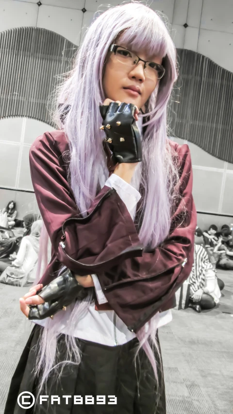 a woman in a purple wig and leather gloves with silver hair