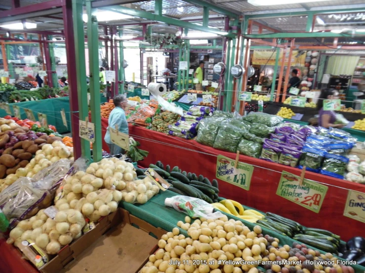 a produce market filled with lots of different types of vegetables