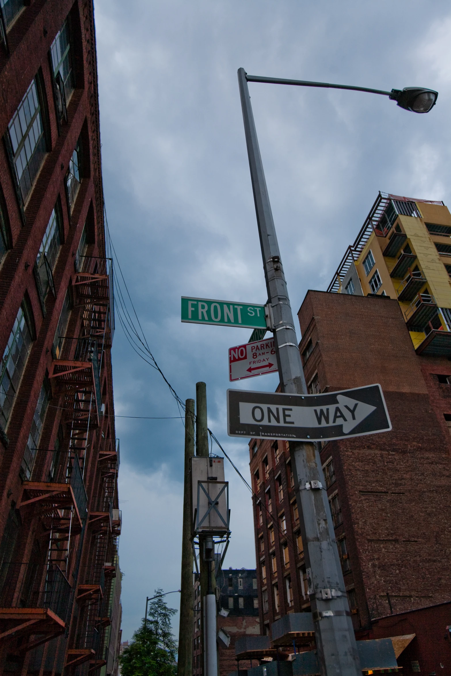 a corner street corner showing two green and white signs