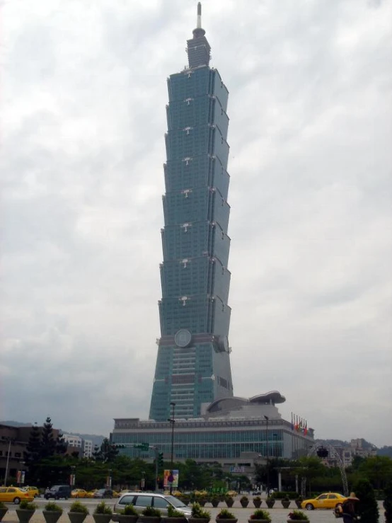 a tall building sitting above a parking lot