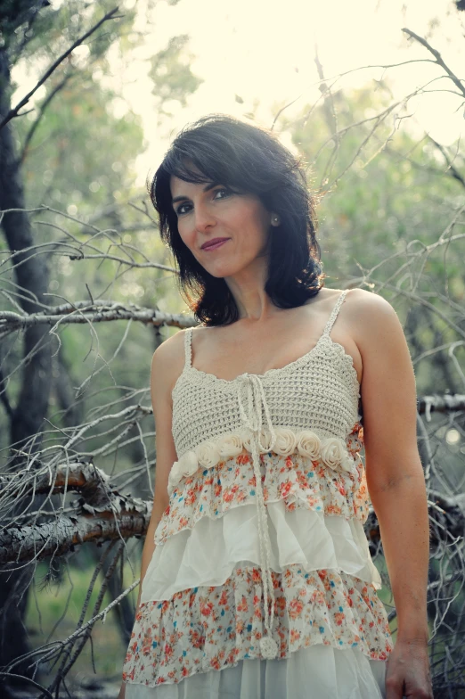 woman in floral dress standing in fenced area