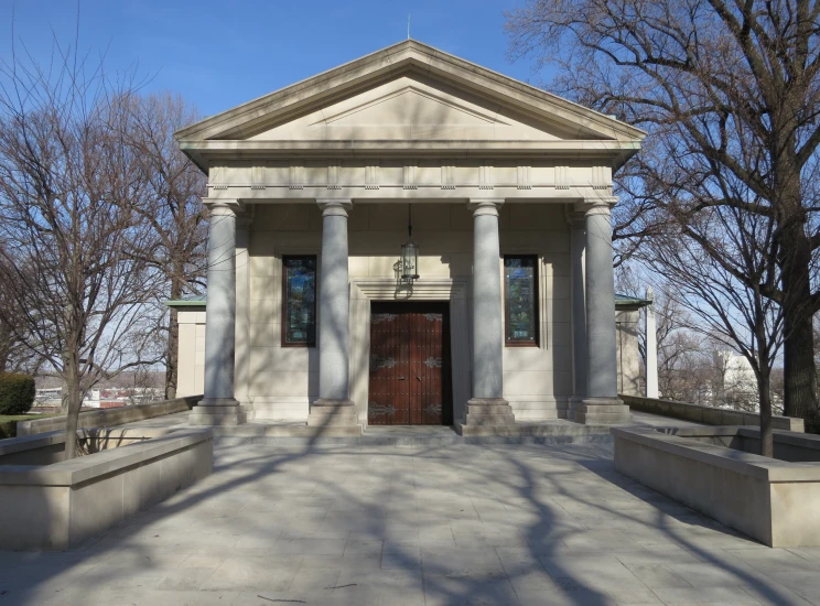 a white church with columns on the front