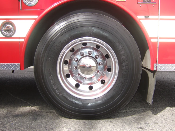 closeup of the tires on a red fire truck