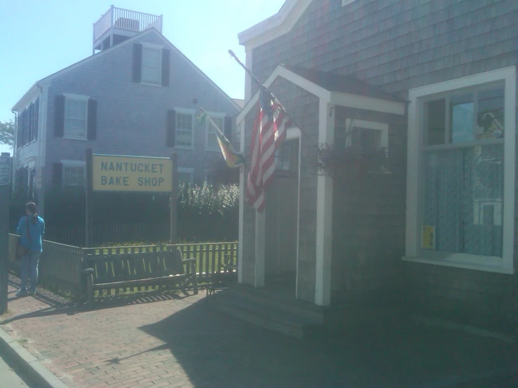 a street view of an american flag displayed on a house