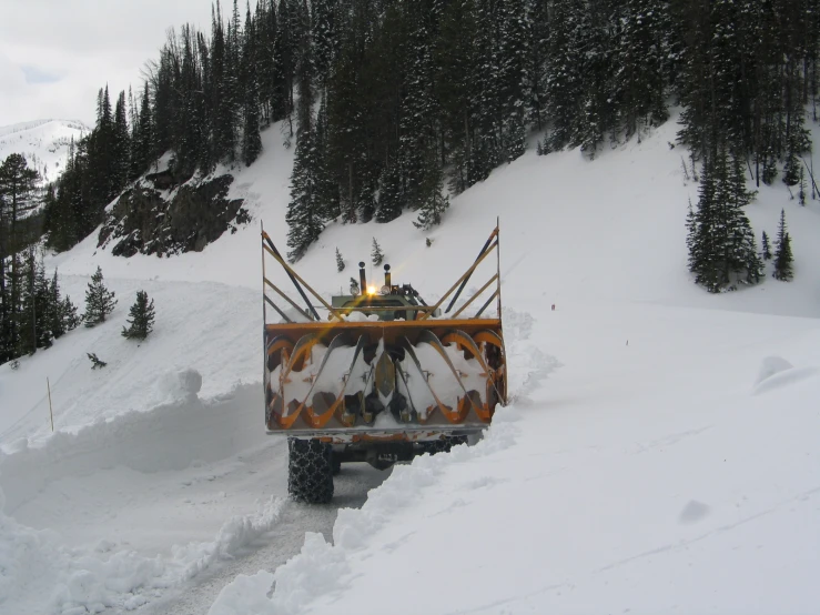 a truck with skis mounted on top of the back of it