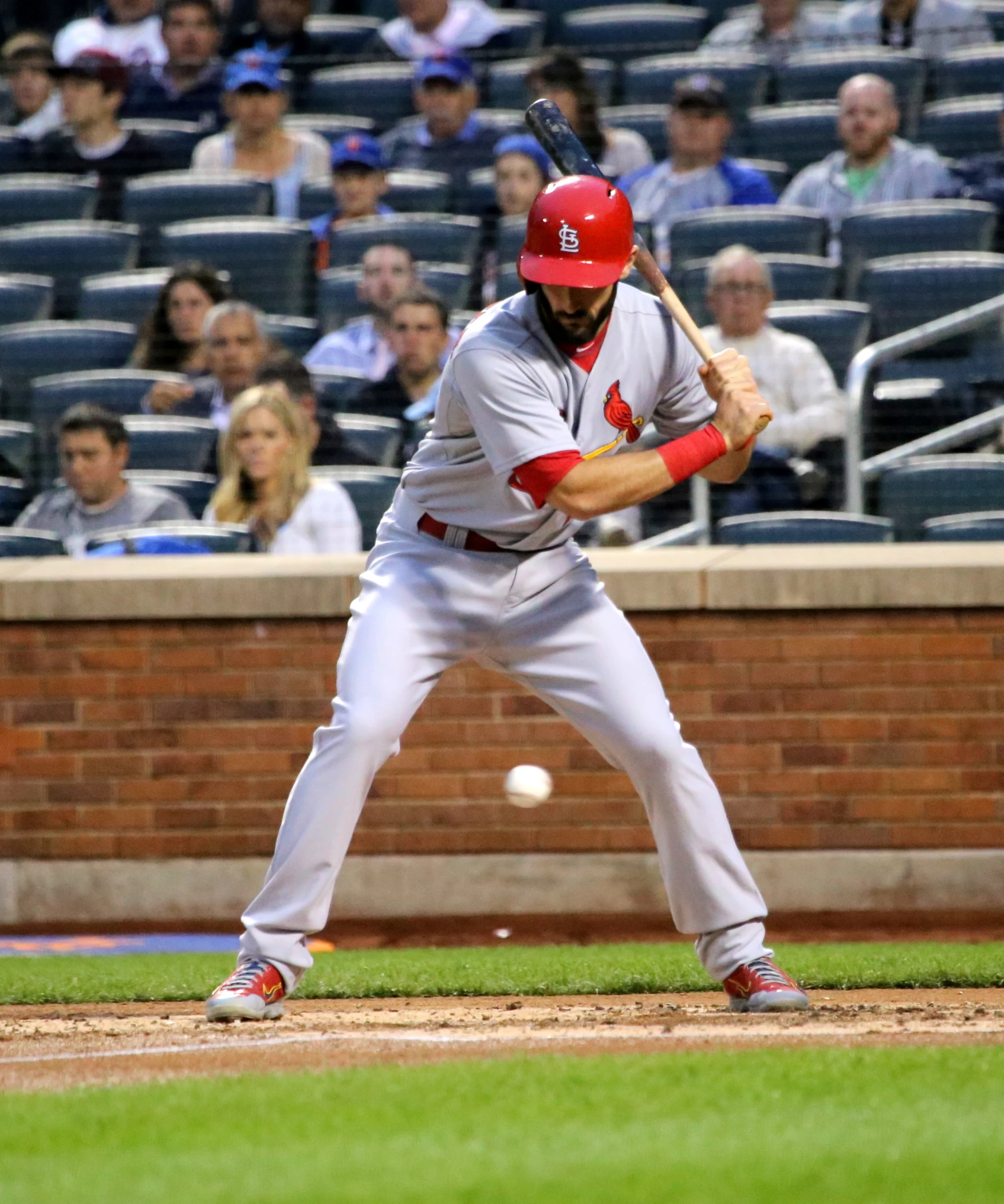 a baseball player is taking a swing at a ball