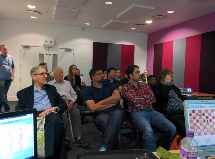 several people sit on a panel and look at one another