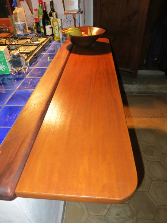 a wooden table with two bowls on top of it