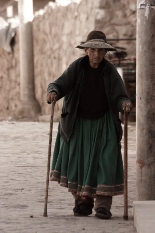an old woman with two canes walking around