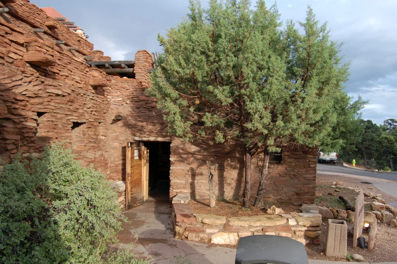 an old building with some trees near by