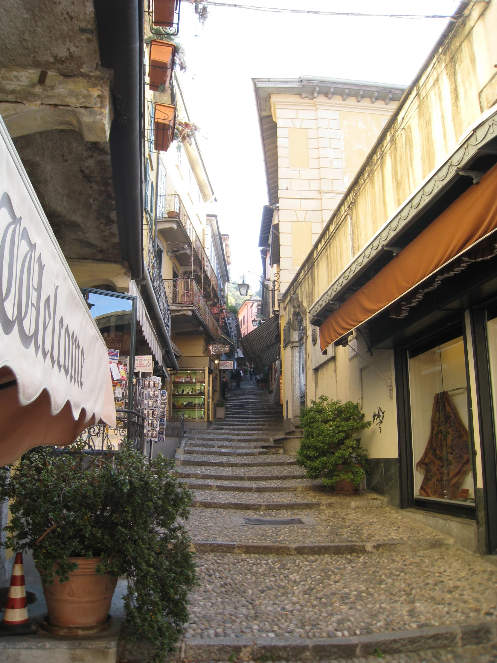 an alley way with steps up to buildings