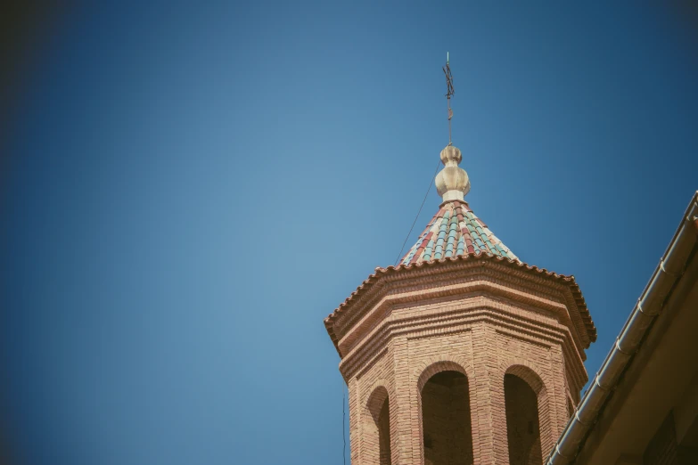 a tall brick tower with a clock on it