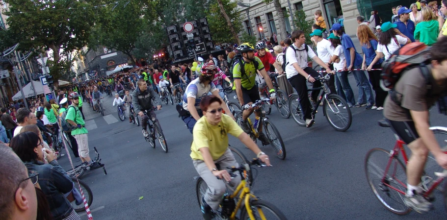 a man riding a bike with lots of bicyclists