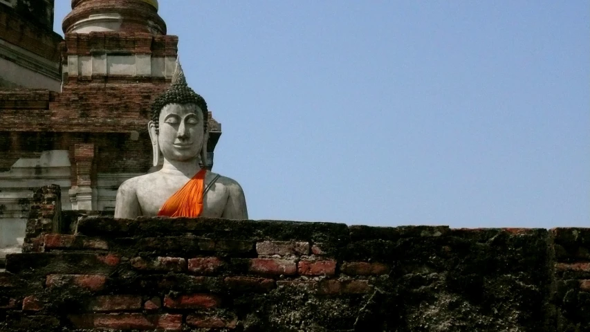 there is an image of a stone buddha statue in the middle
