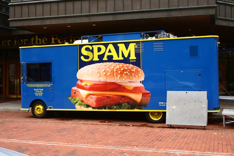 a billboard ad for spam, advertising burgers on the side of a blue truck