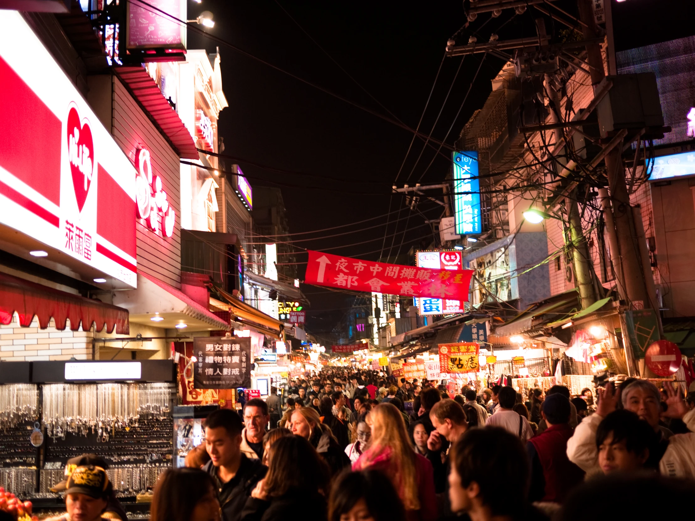 a large group of people standing on a street