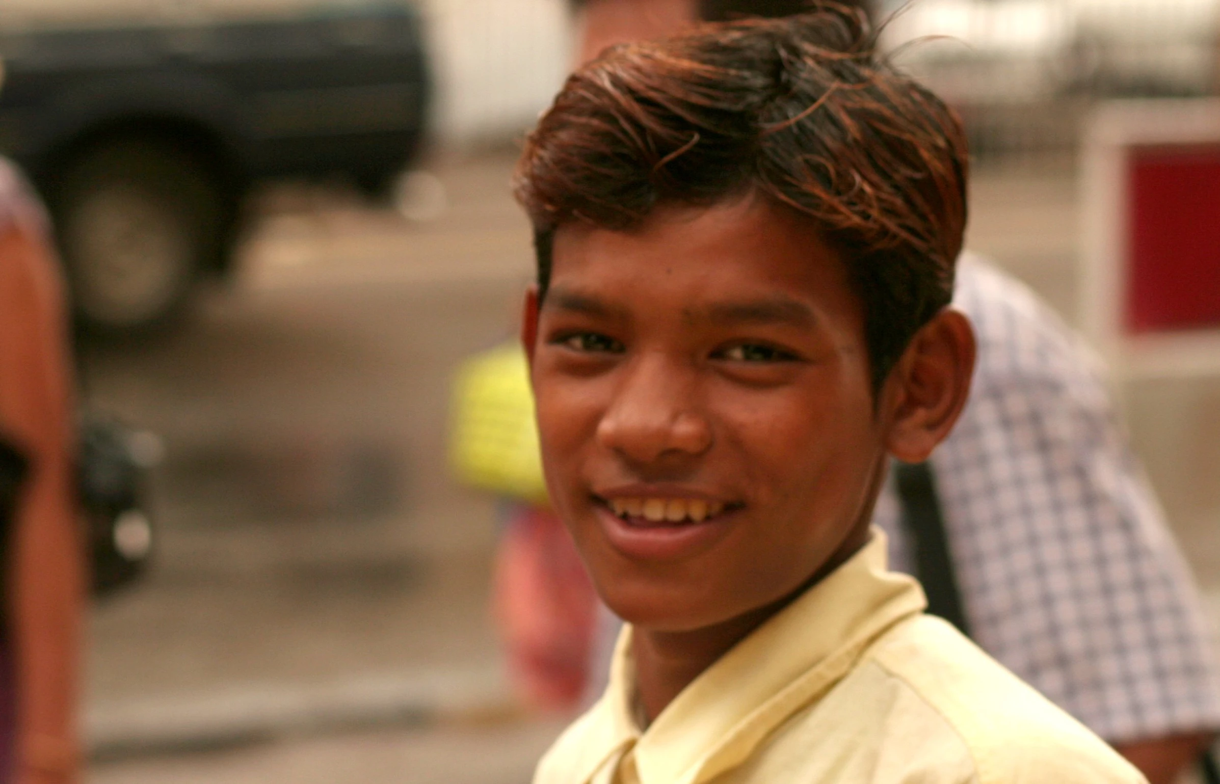 a  smiles as he stands in front of an audience