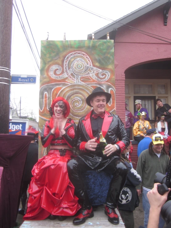 two people dressed as a clown and woman