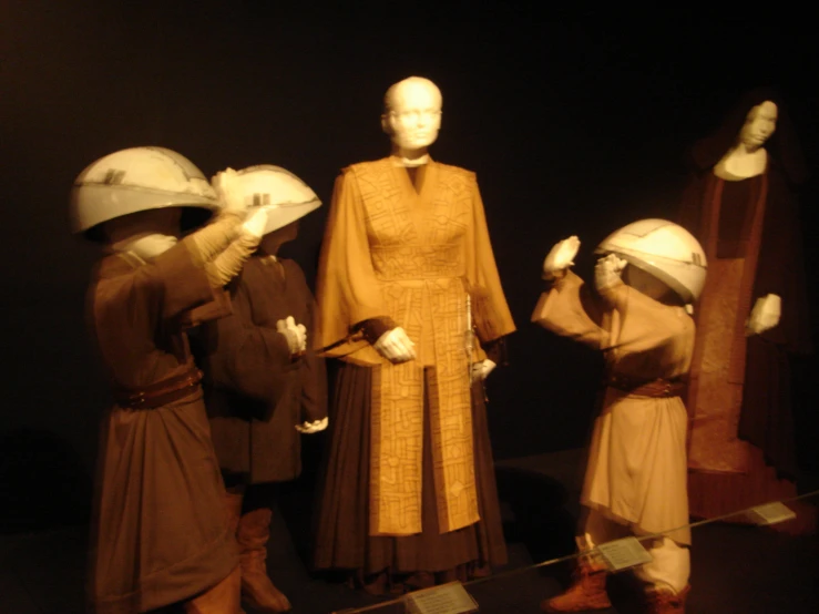 a group of mannequins and other decorative costumes