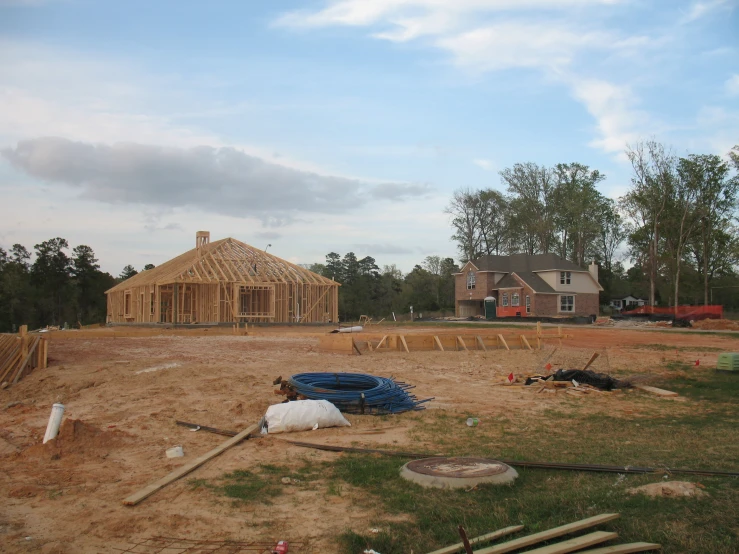 a home being built in the middle of the woods